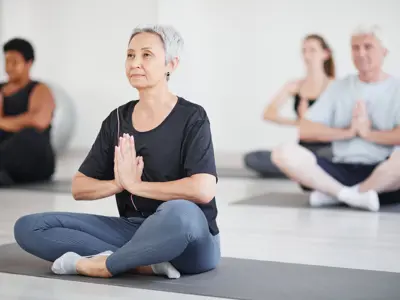 Adults practicing yoga 